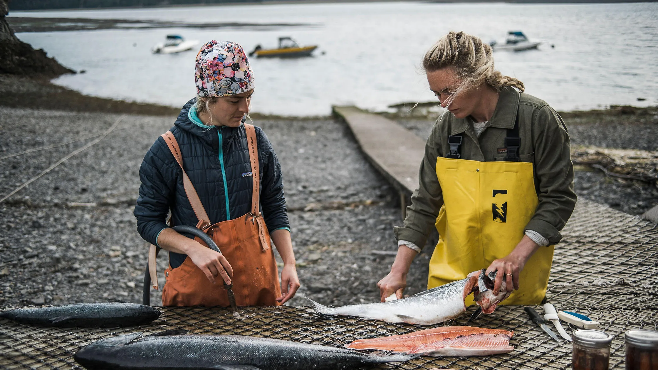 An image of the salmon sisters preparing a salmon, Courtesy Salmon Sisters